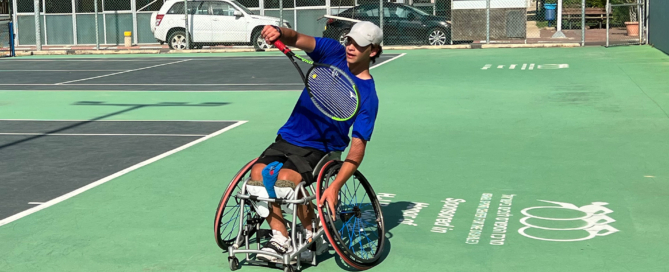 A wheelchair tennis athlete at the Israel ParaSport Center returns a volley during Rabbi Ron Stern's visit in the summer of 2022. (Photo by Rabbi Ron Stern)