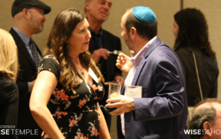 New Stephen Wise Temple Board member Lisa Niver converses with Andrew Cushnir at Board Installation Shabbat in Zeldin-Hershenson Hall on June 16, 2023. (Photo by Raz Husany)