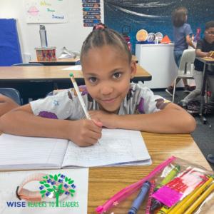 A Wise Readers to Leaders scholar works on a writing project in June of 2023 in a Wise School classroom. (Photo: Wise Readers to Leaders)